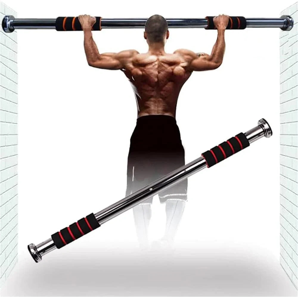 Man performing pull-ups on a pull-up bar with red grips against a white brick wall.