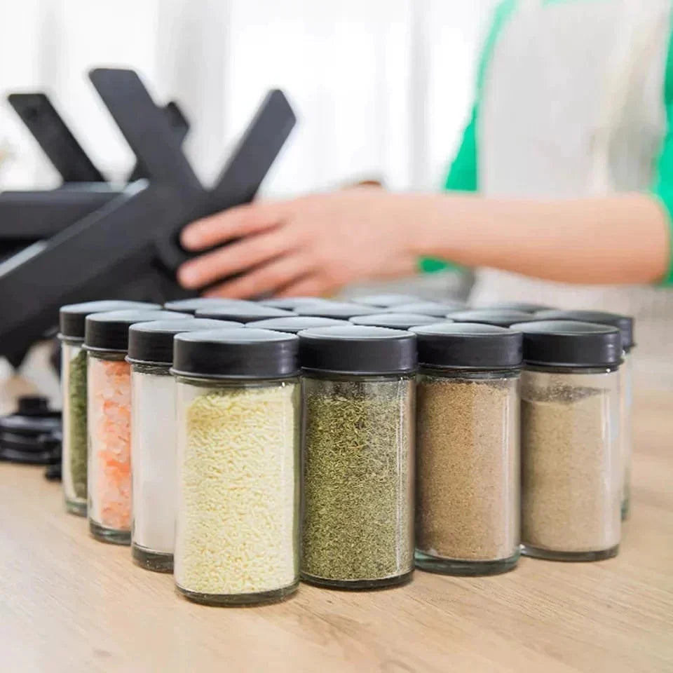 "Modern kitchen spice organizer with black lids"