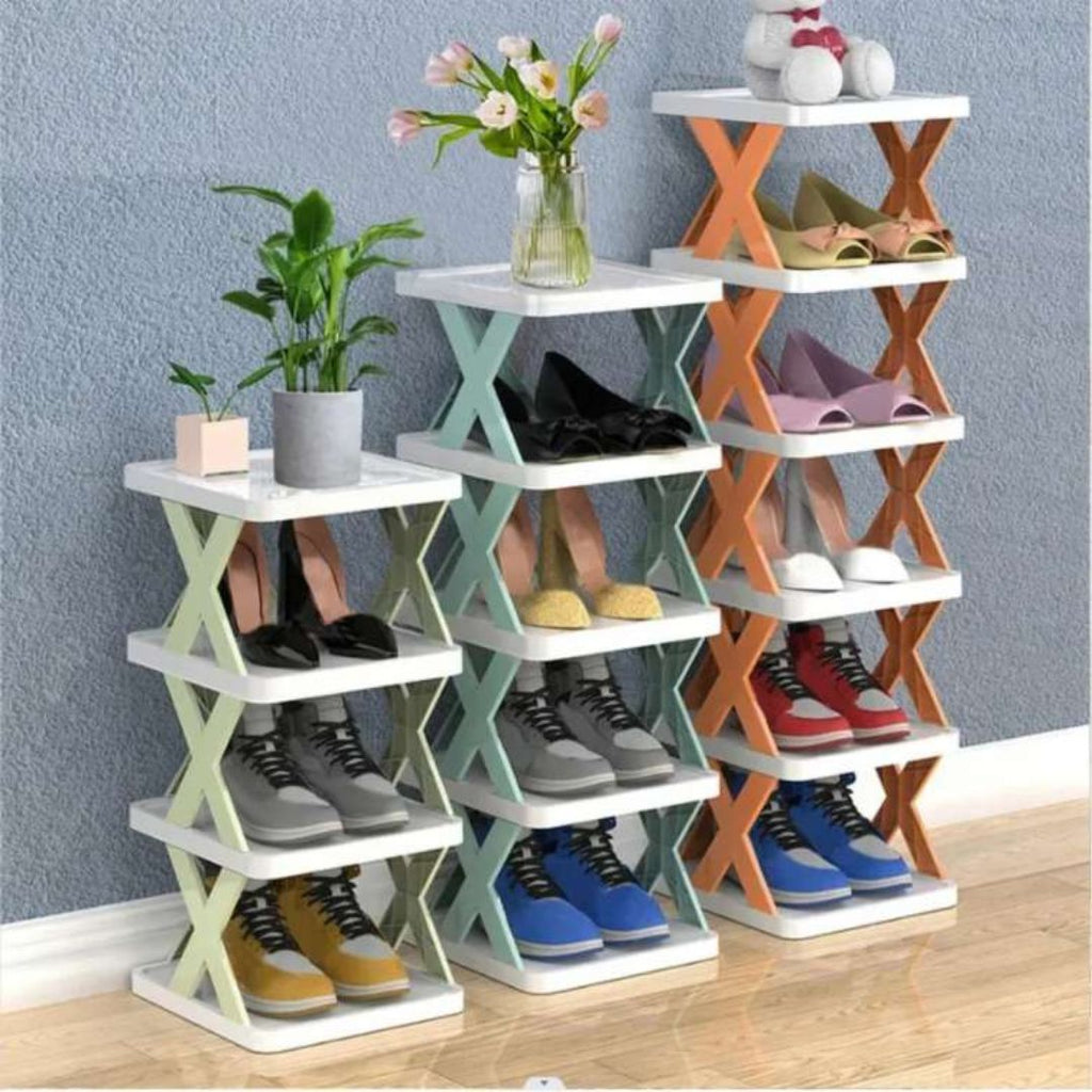 Three shoe shelves with shoes and decorative items against a blue wall.