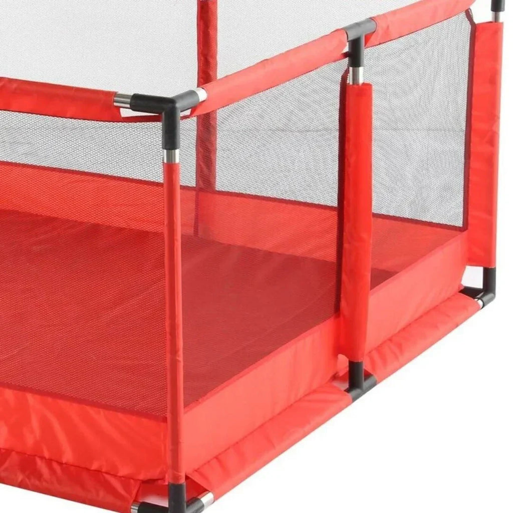 Red trampoline with safety net on a white background