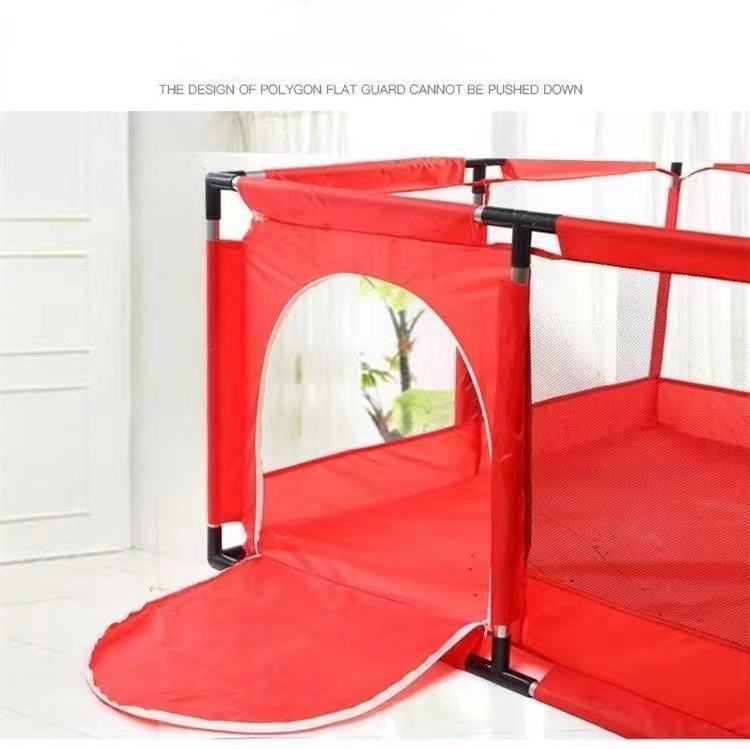 Red playpen with a transparent door on a white floor.